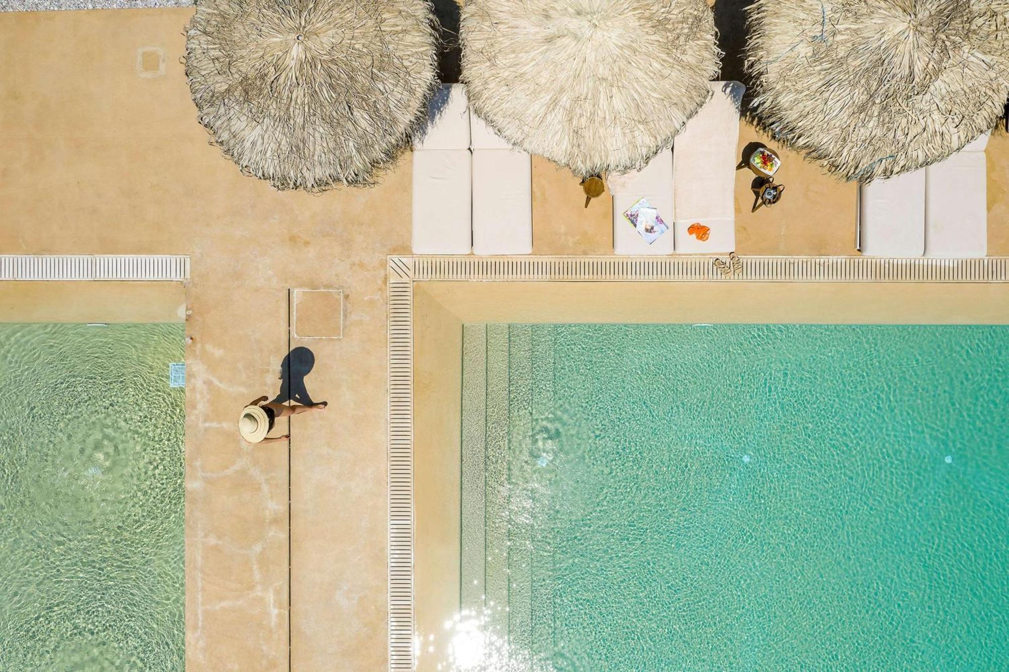 Isla Brown Corinthia Resort & Spa, Curio Collection By Hilton Agioi Theodoroi Exterior photo Aerial view of the pool